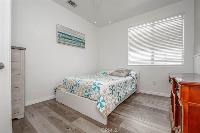 bedroom with light hardwood / wood-style flooring