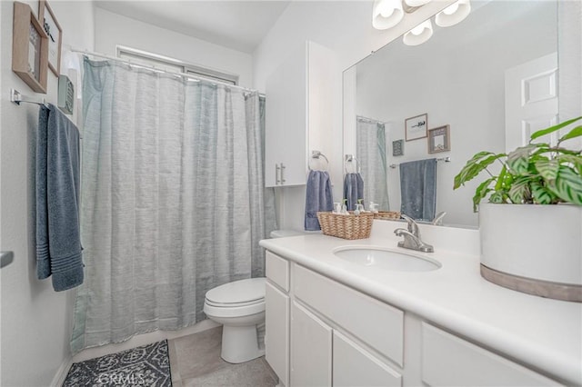 bathroom with toilet, tile patterned floors, and vanity