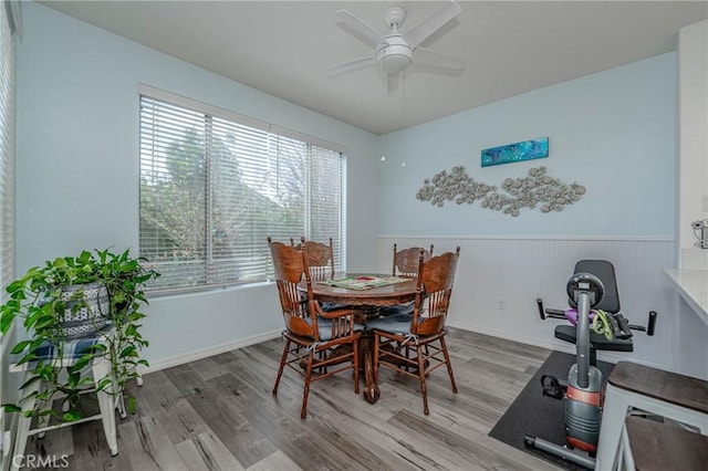 dining area featuring light wood-type flooring and ceiling fan