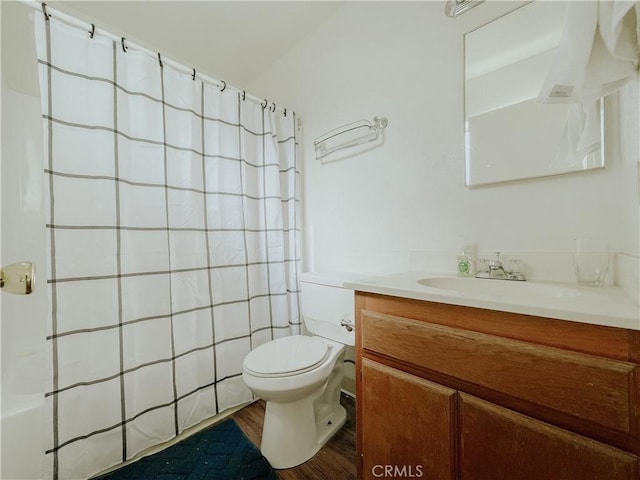 bathroom featuring vanity, hardwood / wood-style flooring, and toilet