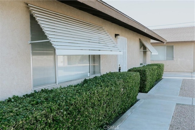 view of home's exterior with stucco siding