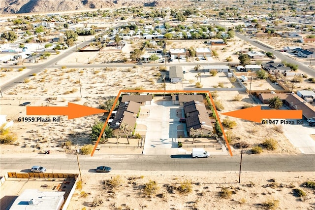 aerial view featuring view of desert and a mountain view