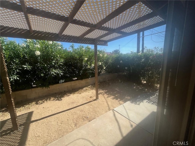 view of patio with fence and a pergola