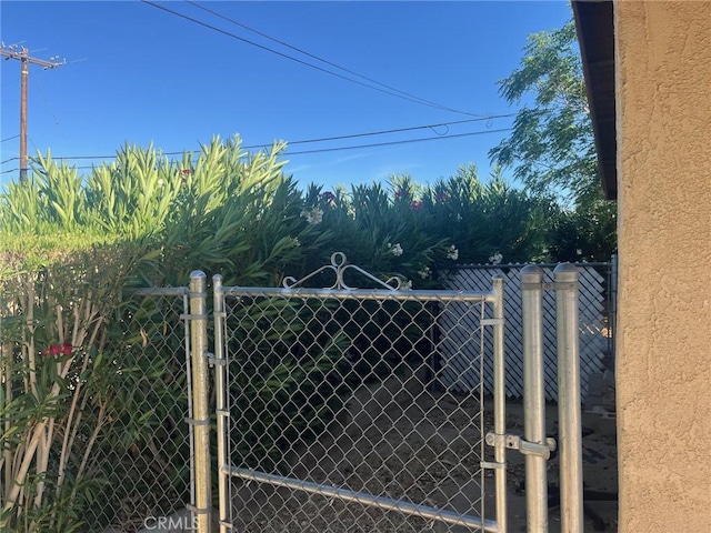 view of gate with fence