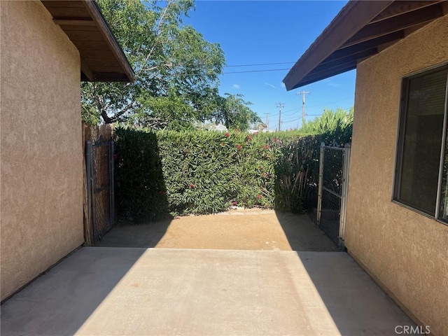 view of patio featuring fence