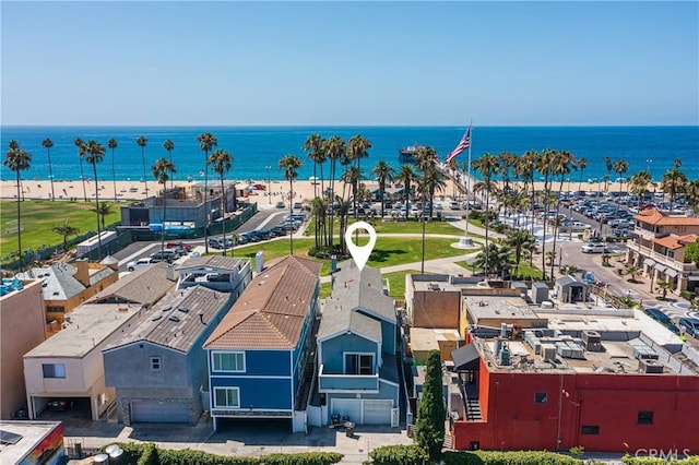 drone / aerial view with a water view and a view of the beach