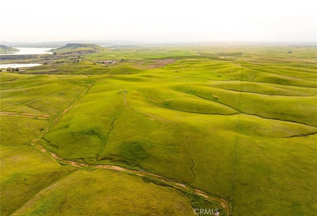 aerial view with a rural view and a water view