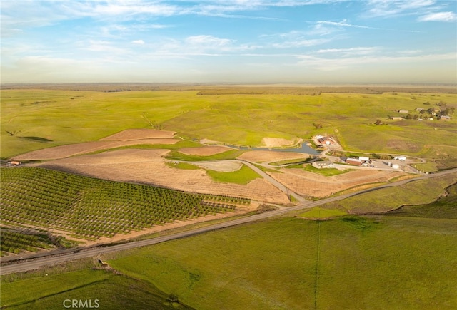 birds eye view of property with a rural view