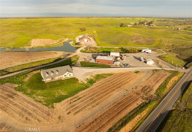 bird's eye view featuring a water view and a rural view