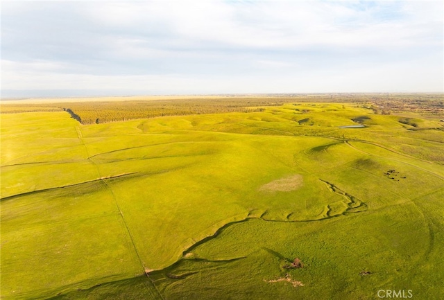 birds eye view of property featuring a rural view