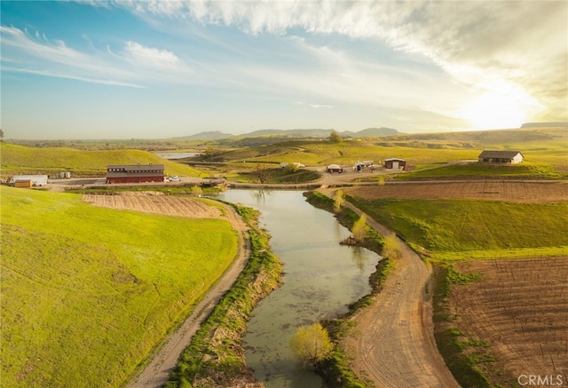 exterior space with a water view and a rural view