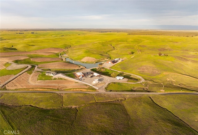 birds eye view of property with a rural view