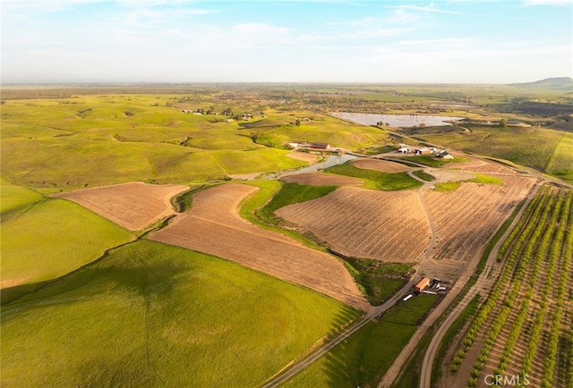 birds eye view of property with a rural view