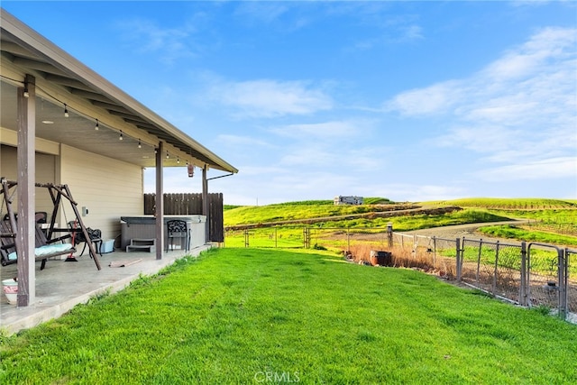 view of yard with a patio and a rural view