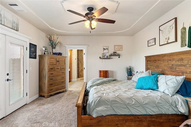 carpeted bedroom with ceiling fan and multiple windows