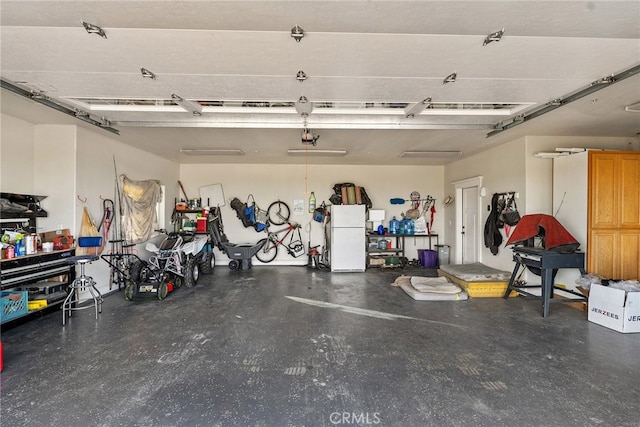 garage featuring white refrigerator