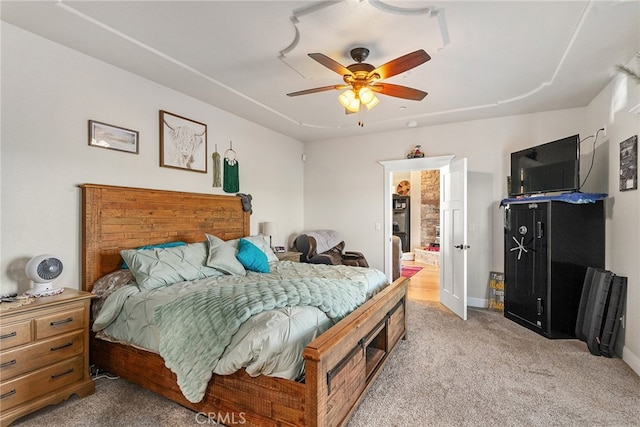 bedroom featuring light carpet and ceiling fan