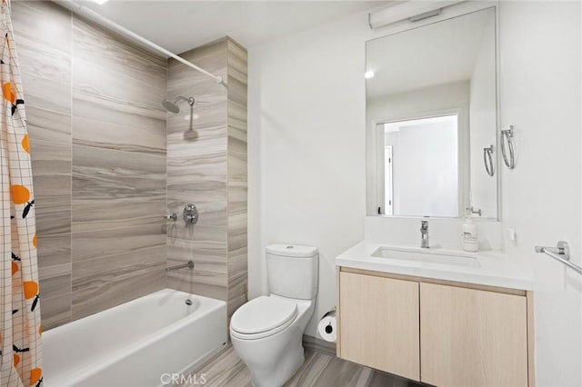 full bathroom featuring hardwood / wood-style floors, vanity, toilet, and shower / tub combo with curtain