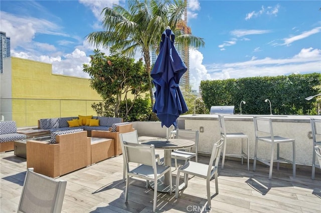 wooden deck featuring an outdoor hangout area