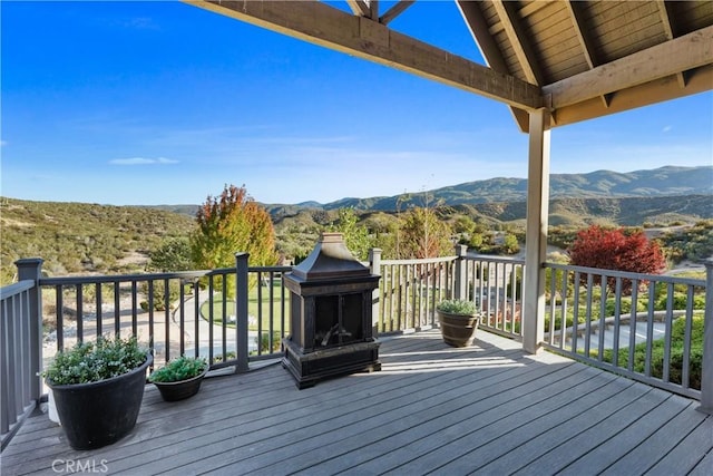 wooden terrace with a mountain view