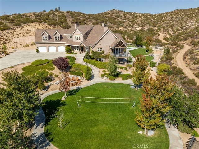 birds eye view of property with a mountain view