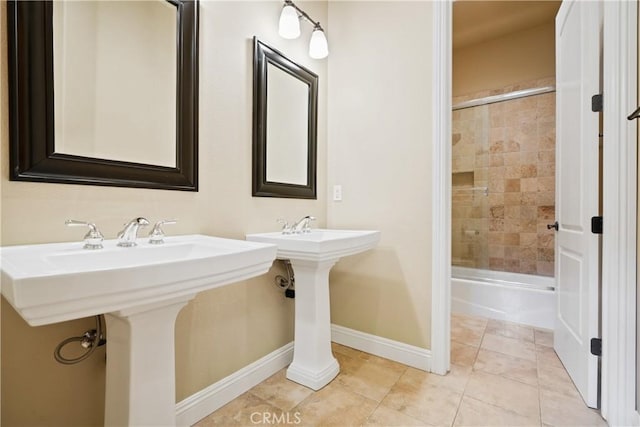 bathroom featuring tile patterned floors and tiled shower / bath