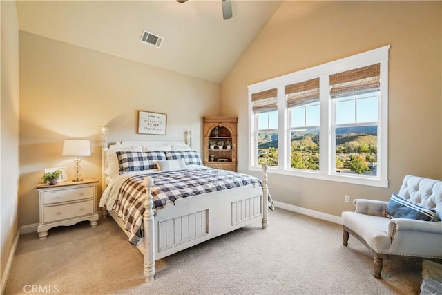 bedroom featuring ceiling fan, light colored carpet, and lofted ceiling