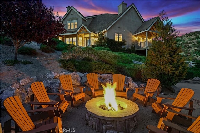 patio terrace at dusk with an outdoor fire pit