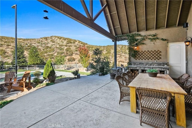 view of patio / terrace with a mountain view