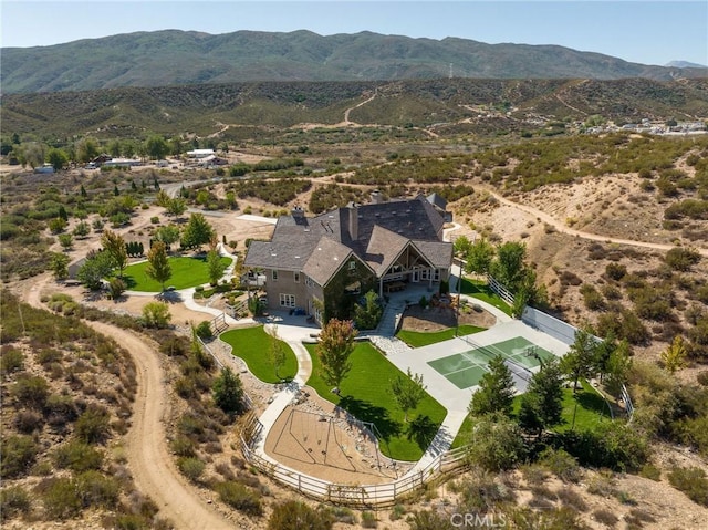 birds eye view of property featuring a mountain view