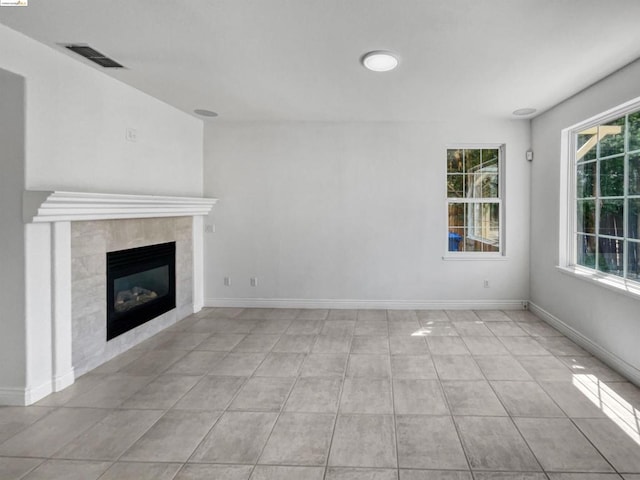 unfurnished living room with a fireplace