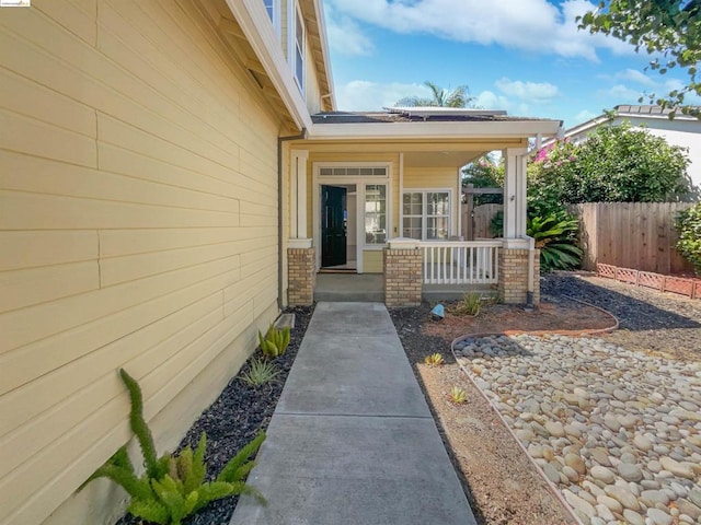 property entrance featuring a porch