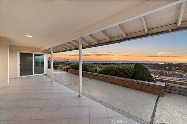 view of patio terrace at dusk