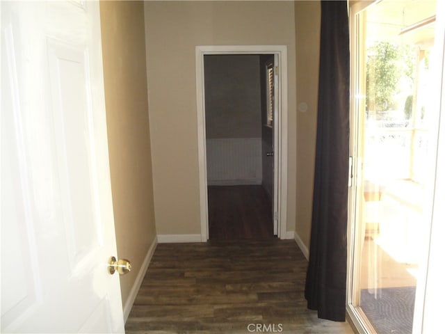 hallway featuring dark hardwood / wood-style flooring