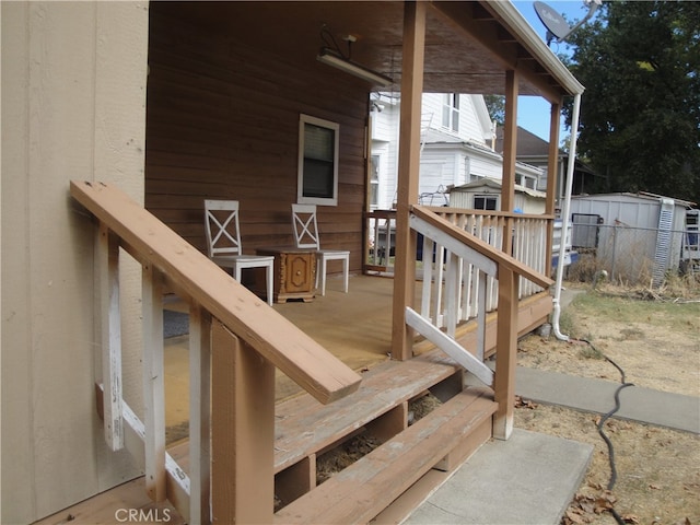 wooden deck featuring a shed