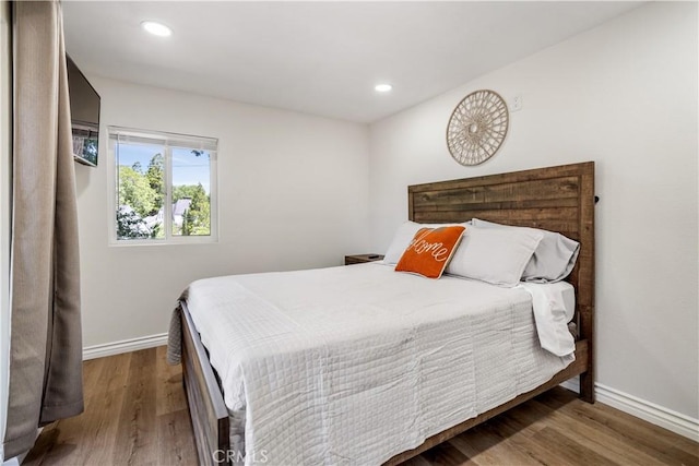 bedroom featuring hardwood / wood-style floors