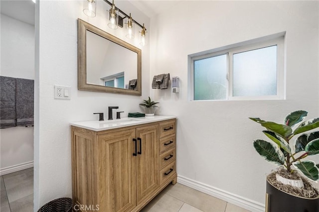 bathroom featuring tile patterned flooring and vanity