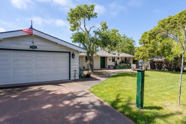 ranch-style home with a garage and a front lawn