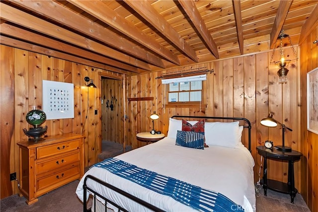 carpeted bedroom featuring beamed ceiling, wooden ceiling, and wooden walls