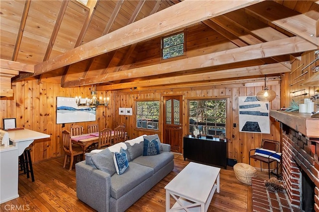 living room featuring wood-type flooring, vaulted ceiling with beams, wooden walls, and wood ceiling