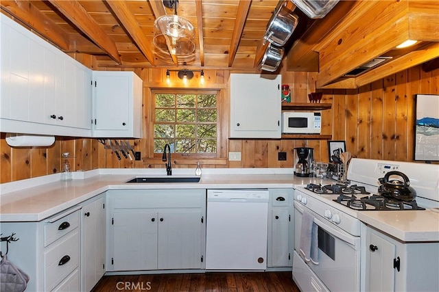 kitchen featuring white appliances, sink, pendant lighting, wooden ceiling, and white cabinetry