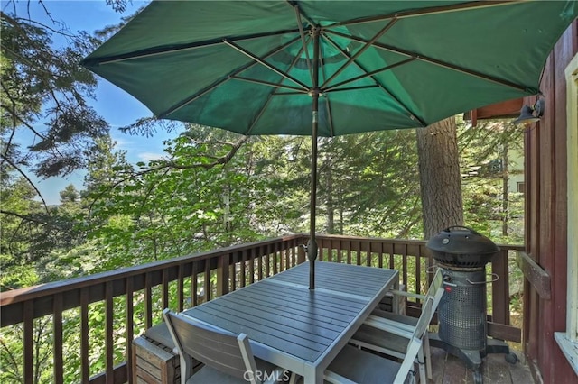 wooden terrace with area for grilling