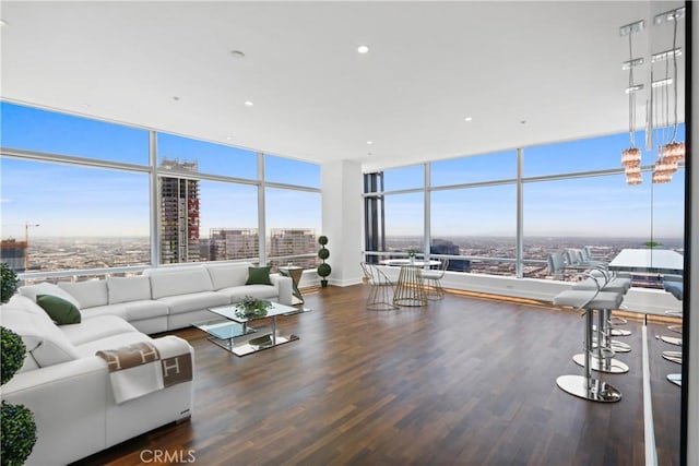 900 W Olympic Blvd Unit 42A, Los Angeles, CA 90015 - living area with a view of city, wood finished floors, expansive windows, and recessed lighting