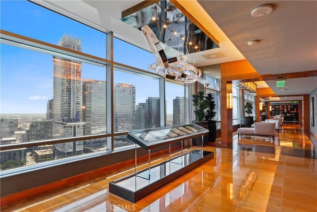 900 W Olympic Blvd Unit 42A, Los Angeles, CA 90015 - sunroom / solarium with a chandelier, a city view, and healthy amount of natural light