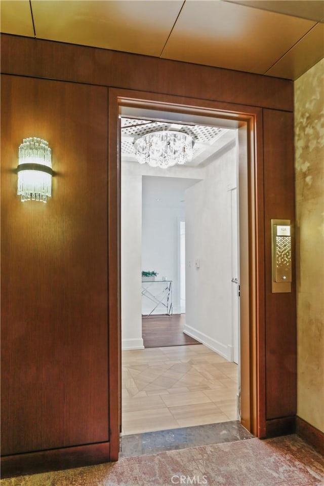 900 W Olympic Blvd Unit 42A, Los Angeles, CA 90015 - corridor with a chandelier and baseboards