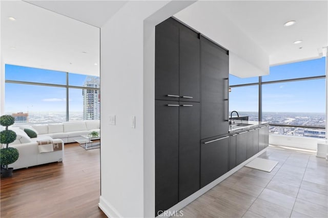 900 W Olympic Blvd Unit 42A, Los Angeles, CA 90015 - corridor with healthy amount of natural light, a view of city, and expansive windows
