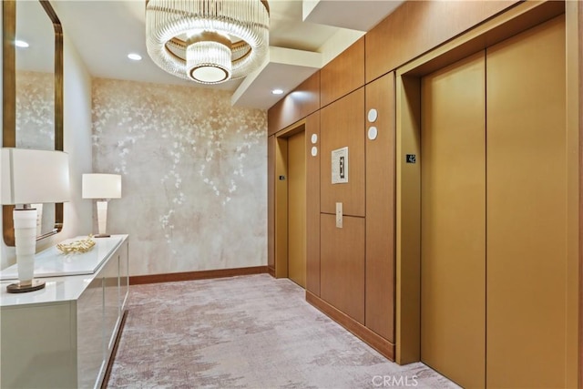 900 W Olympic Blvd Unit 42A, Los Angeles, CA 90015 - hallway with elevator, light carpet, and a chandelier
