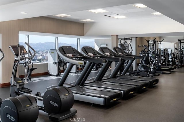 exercise room featuring a mountain view