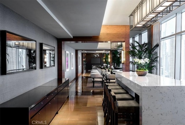 interior space with dark brown cabinets and hardwood / wood-style flooring