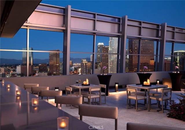 900 W Olympic Blvd Unit 42A, Los Angeles, CA 90015 - patio at night with a view of city lights and a patio area